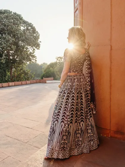 A commercial shoot featuring a model in a traditional Indian lehenga, captured during the golden hour. I used the natural backlight to create a soft, ethereal glow that accentuates the intricate embroidery of the garment.