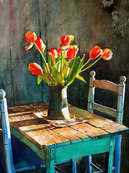 The beauty of a simple scene. This still life of tulips on a rustic table is an exercise in capturing atmosphere, the texture of wood, and the play of light streaming in from a window.