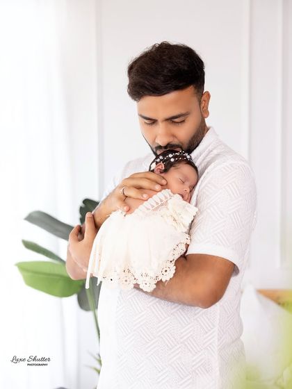 A father's gentle kiss for his sleeping baby. These are the precious, fleeting moments I strive to preserve for you forever.