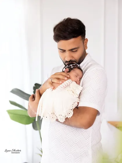 A father's gentle kiss for his sleeping baby. These are the precious, fleeting moments I strive to preserve for you forever.