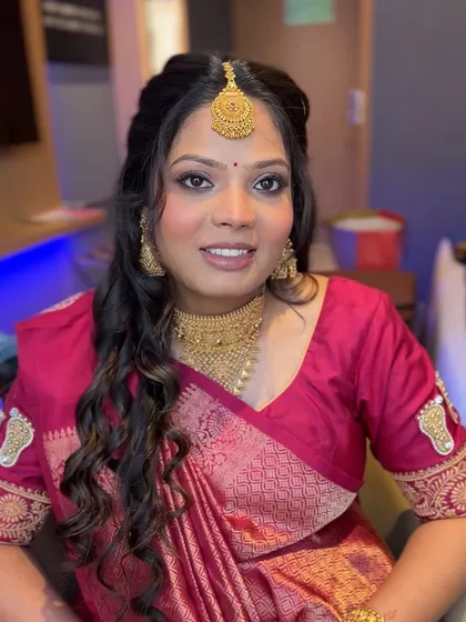 Another portrait of the mom-to-be, looking serene and beautiful. The makeup enhances her natural pregnancy glow.