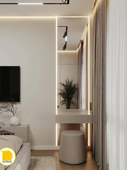 A minimalist dressing table integrated into the bedroom design. The floating design and backlit mirror create a sleek and modern look.