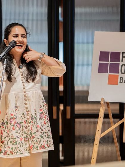 A moment of laughter and joy on stage. Our events are a celebration of the strength and spirit of the women in our community.