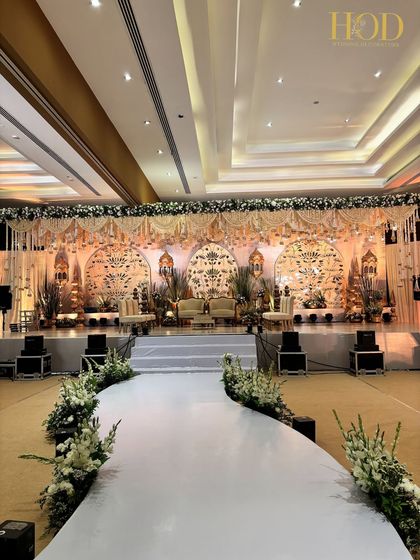 A wide-angle shot of the entire hall, with the grand stage as the undeniable focal point, showcasing the scale of the event.