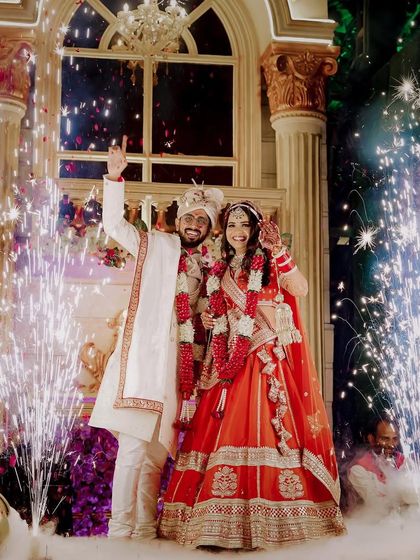 The grand varmala moment for Ravi and Reewa, complete with pyrotechnics and smoke effects.