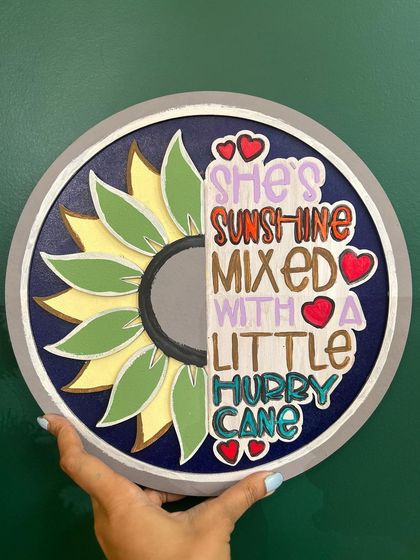 Here's a finished "sunshine mixed with a little hurricane" wall hanging. Our favorite part is watching you come to our space and create a masterpiece that reflects your personality.