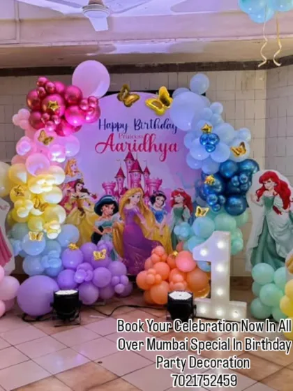 I make fairy tales come true with my Disney Princess themed decorations. This setup for a first birthday features a beautiful castle backdrop and life-sized cutouts of all her favorite princesses, from Cinderella to Ariel.