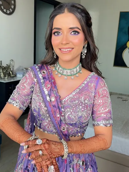 The bride's happy smile, with her hair elegantly framing her face.