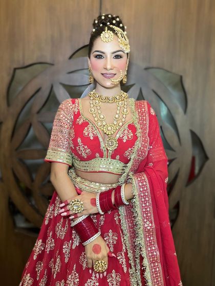 An extensive series of our classic red bridal lehenga. These images capture every detail, from the embroidery to the full bridal styling, providing a complete reference.