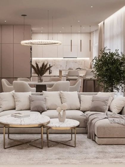 Another view of the open-plan layout, showing the cohesion between the living room, dining area, and kitchen. This approach is perfect for modern family living and entertaining.