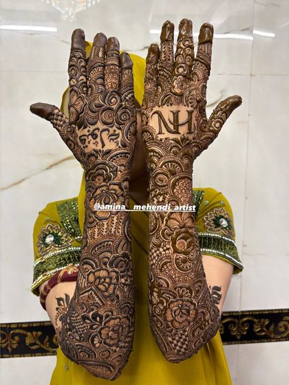 A full view of the design with the initials 'N' and 'H' and the name 'Fawad' in Arabic.