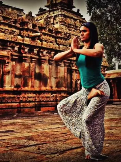 Finding stillness in sacred spaces. Here, I am practicing a balancing asana in front of an ancient temple, drawing energy from the history and spirituality of the place. My retreats often include visits to such culturally rich sites.