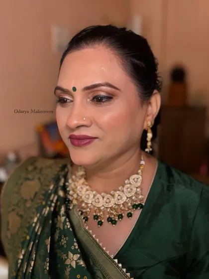 A side profile of the mature skin makeup, showing the soft contouring and the beautiful shimmer on her eyelids.