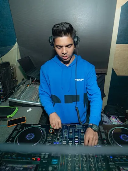 A tight shot of me focused on the mixer, deep in the mix.