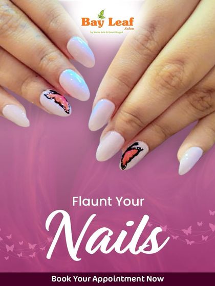 Flaunt your nails with this delicate butterfly design. This look features a soft, shimmery white base on almond-shaped nails with a beautifully detailed butterfly wing on the accent nail.
