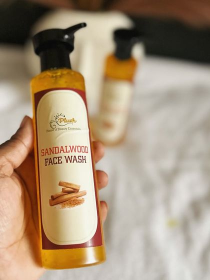 Holding my new Sandalwood Face Wash. Its natural ingredients help remove impurities and reduce acne, all with a soothing, earthy aroma.
