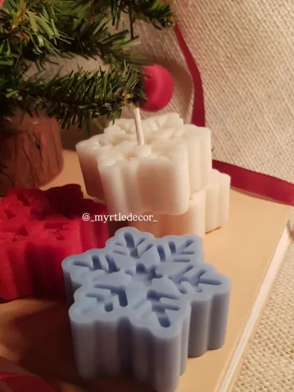Our Snowflake Candles are a little piece of winter magic. We hand-pour each one with scented soy wax, capturing the delicate shape of a snowflake. They are available in classic winter colors and make a perfect Secret Santa gift or stocking stuffer.