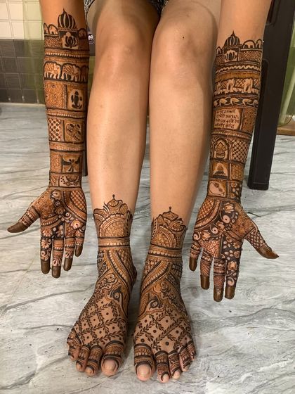A complete bridal look with matching mehndi on hands and feet. The design features traditional elephant motifs and jaal patterns for a cohesive and stunning appearance.