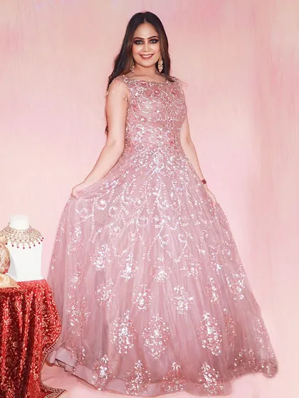 Every girl deserves a ball gown moment. This shimmering pink gown is available to rent, so you can have your fairytale moment without the fairytale price.