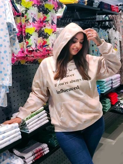 A duplicate of image 96, the influencer-themed hoodie.