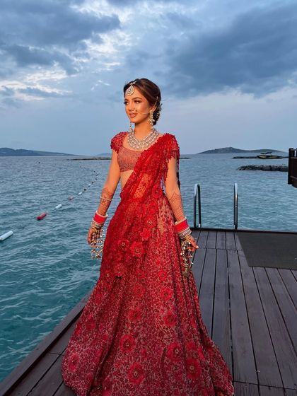 The bride enjoying the twilight, her hair perfectly styled in a romantic and soft updo.