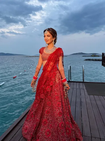 The bride enjoying the twilight, her hair perfectly styled in a romantic and soft updo.