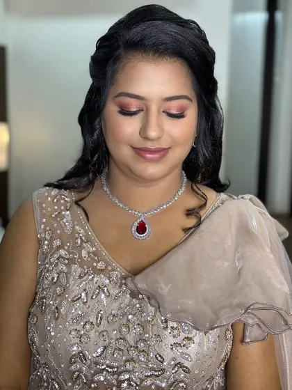 A close-up of Puja's engagement makeup, showing the flawless blend and radiant skin.