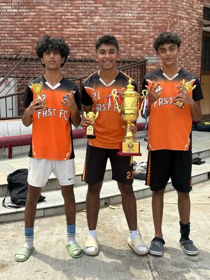 Three key players from our U15 championship-winning team showcasing their individual and team awards.