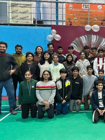 **The Team Behind the Champion.** Daksh Raj with his teammates and coaches after celebrating his silver medal. The support of the entire academy is crucial for individual success.