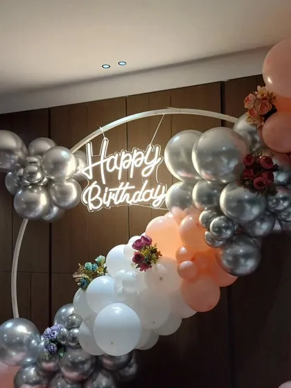 A close-up of the neon sign and the mix of balloon colors and textures.
