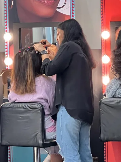 A shot of me working backstage. Being prompt and prepared is key, especially when working on projects with tight schedules and multiple looks.
