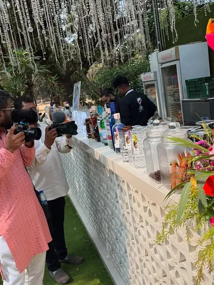 Photographers capturing our beautiful bar setup at the Gallops, Mahalaxmi Race Course. We take pride in creating picture-perfect setups that add to your event's decor.