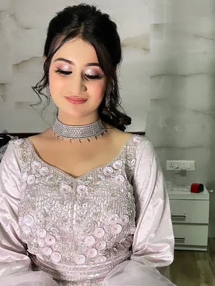 A gorgeous client rocking her cocktail glam. The look features soft, shimmery eyes and a perfectly matched lip color, creating a polished and sophisticated style for her event.