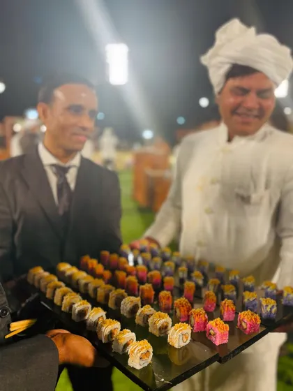 My staff serving trays of colorful and delicious sushi to guests, providing an elegant pass-around service.