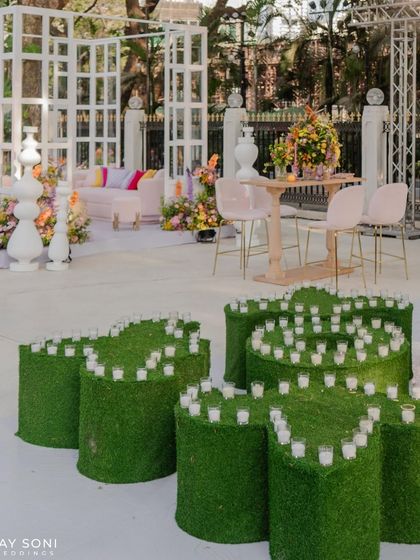 Every detail blossoms with beauty. These heart-shaped candle holders made of moss were a charming and on-theme detail at the "Bloom" wedding.