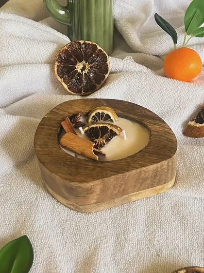 This autumn special scented candle is perfect for creating a warm and inviting atmosphere. The natural soy wax is infused with a blend of spicy and citrus scents, housed in a beautiful hand-finished wooden bowl.