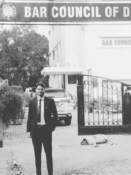 A black and white photo outside the Bar Council of Delhi, where my journey as a registered advocate began.