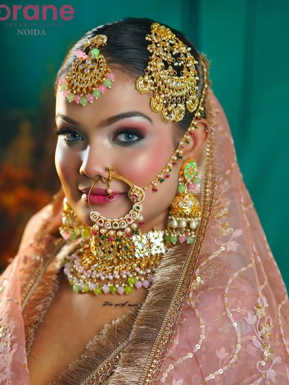 A stunning close-up that captures the model's striking eyes, enhanced by the flawless makeup application.