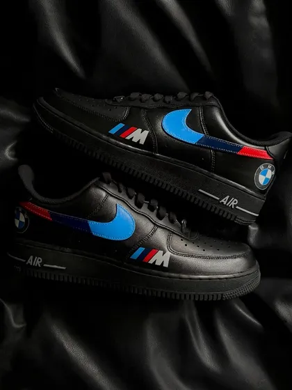 Sleek and powerful, these black Nike Air Force 1s are customized with the iconic BMW M series colors and logo, perfect for any car enthusiast.