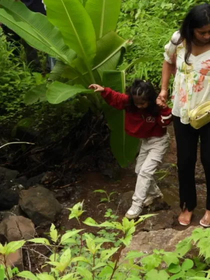 A helping hand from mom makes crossing this little stream an exciting part of the adventure. Our trails are full of these small, memorable challenges.