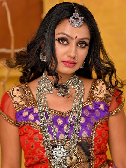 A classic portrait from the Rajasthani series, capturing the model's beauty and the richness of the cultural attire. The direct gaze is powerful and engaging.