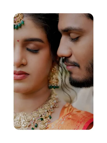 An intimate and artistic close-up of the bride and groom, their eyes closed in a moment of serene connection.