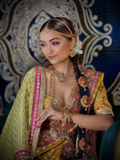 A side profile of the South Indian bridal look, highlighting the intricate hairstyle and jewelry.