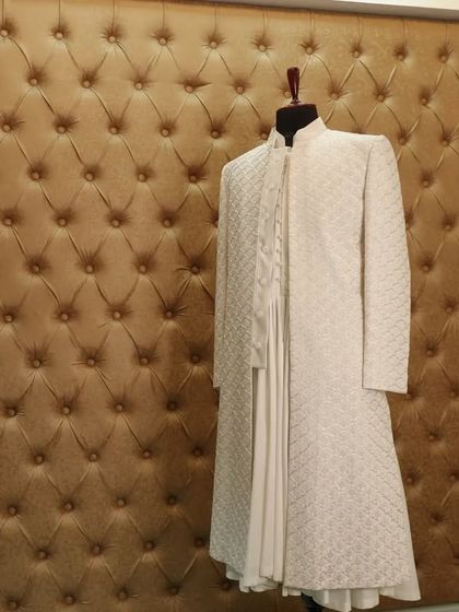 For a look of pure sophistication, we crafted this white-on-white sherwani, where the texture of the self-embroidery provides a subtle, luxurious detail.