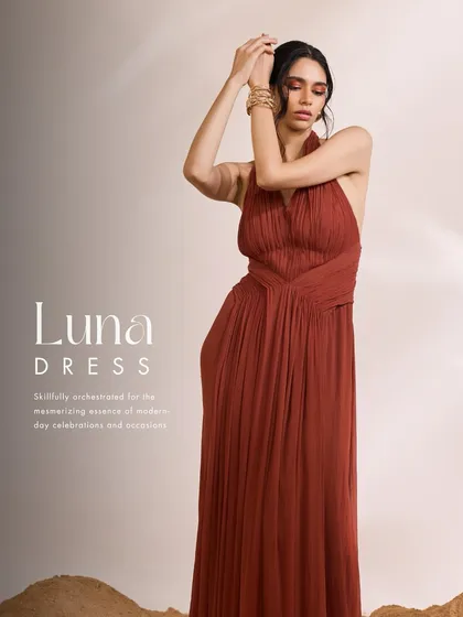 The Luna Dress in a rich rust hue, designed for contemporary sophistication. I used intricate pleating and expert gathering to create a flowing, elegant silhouette with a captivating backless design.