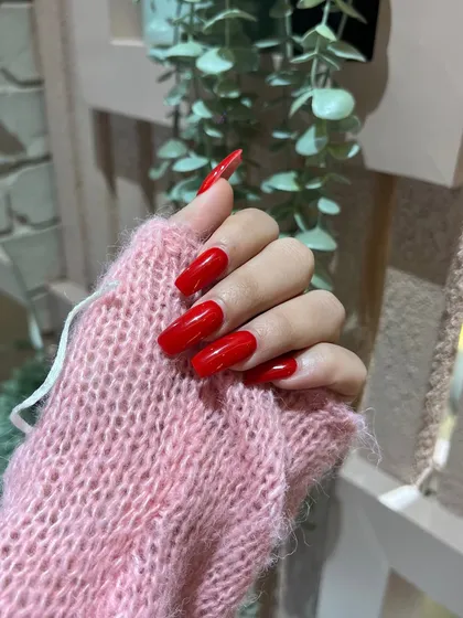 You can never go wrong with a classic red. This bold, glossy red manicure on long, square-shaped nails is pure confidence.