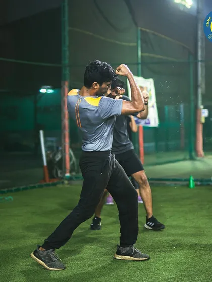 An athlete sharpens his technique with shadow boxing drills on the turf. This fundamental practice is key for improving form, footwork, and muscle memory without a partner.