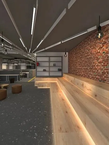 A 3D render of a town-hall-style breakout space for FedEx. The design incorporates tiered wooden seating and an exposed brick wall to foster a collaborative and informal company culture.
