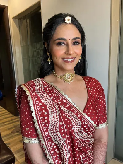 A final portrait of the bride, looking absolutely radiant. The makeup is soft, fresh, and enhances her natural beauty.