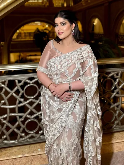 A confident pose from Sanjana, showcasing her beautiful cocktail glam. The shimmery eyes and glowing skin are my signature.
